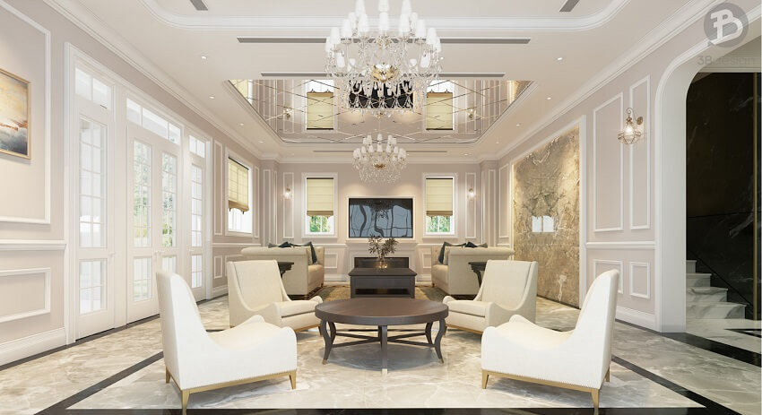 Phòng khách nhà biệt thự với chi tiết trang trí sang trọng như đèn chùm và sofa bọc da màu trắng